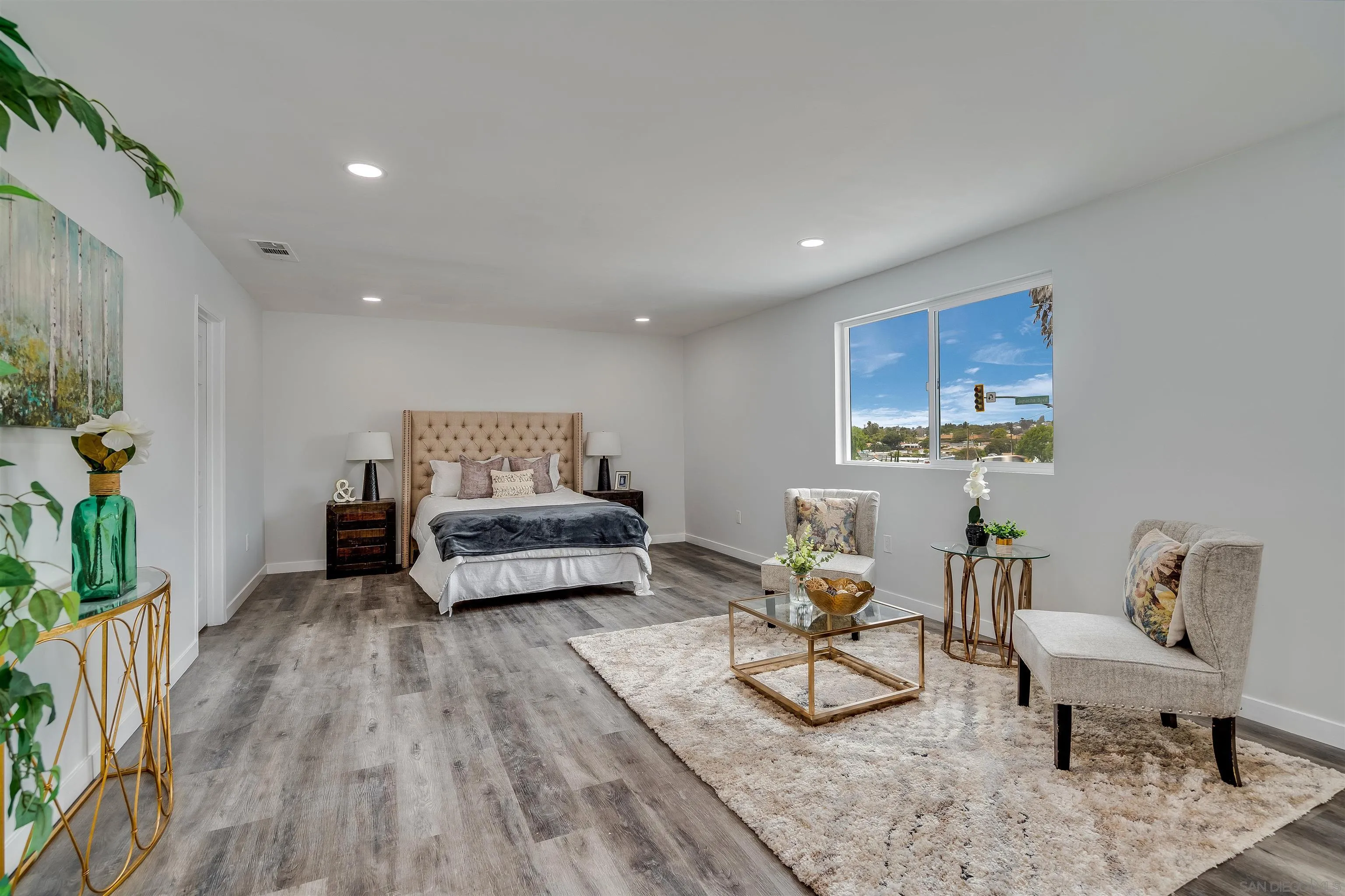 9209 Jamacha Boulevard Spring Valley, CA 91977 - Photo 14 of 22 a living room with furniture and a wooden floor