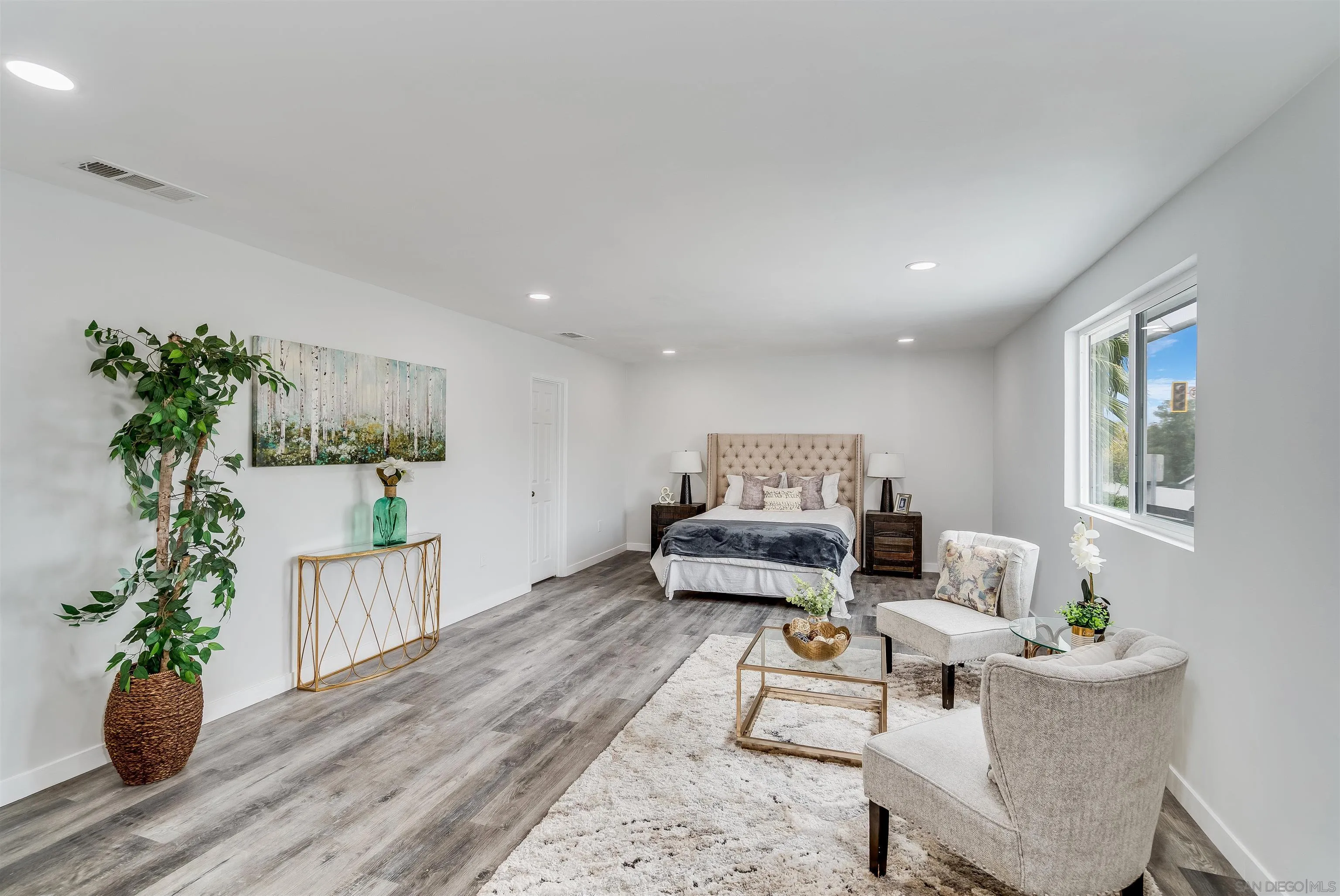 9209 Jamacha Boulevard Spring Valley, CA 91977 - Photo 15 of 22 a living room with furniture and a potted plant