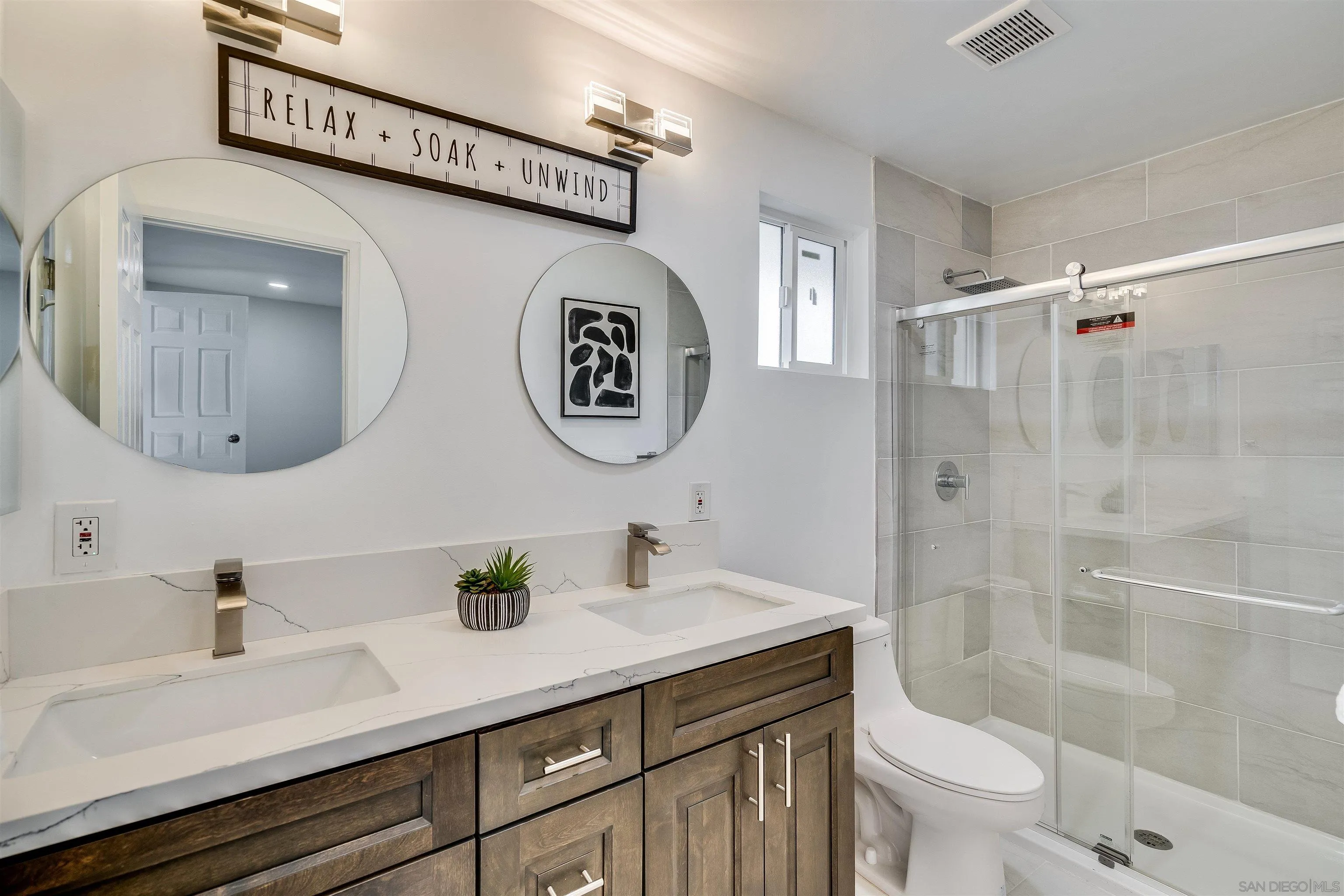 9209 Jamacha Boulevard Spring Valley, CA 91977 - Photo 16 of 22 a bathroom with a sink a toilet and shower