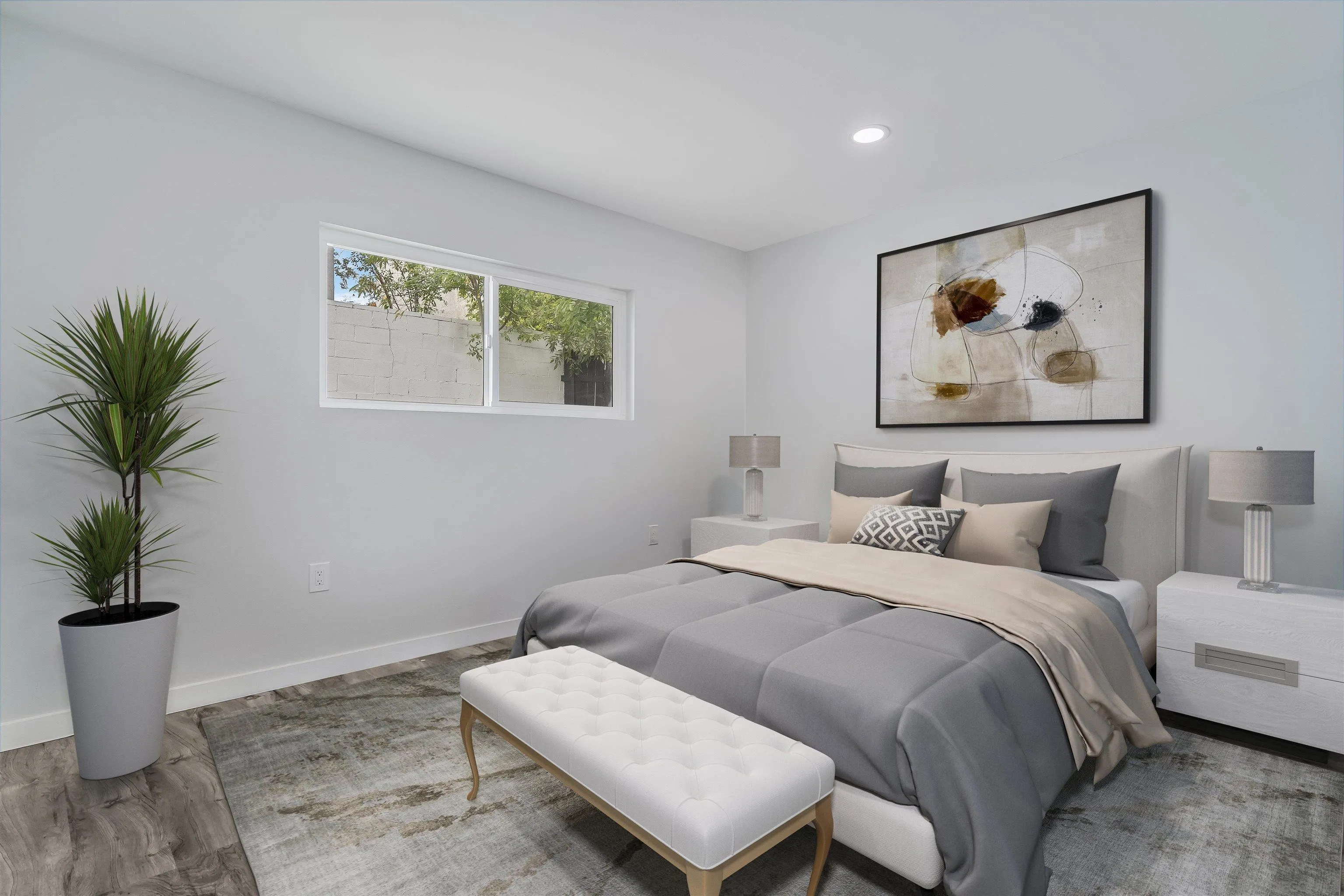 9209 Jamacha Boulevard Spring Valley, CA 91977 - Photo 19 of 22 a bedroom with a large bed and a potted plant