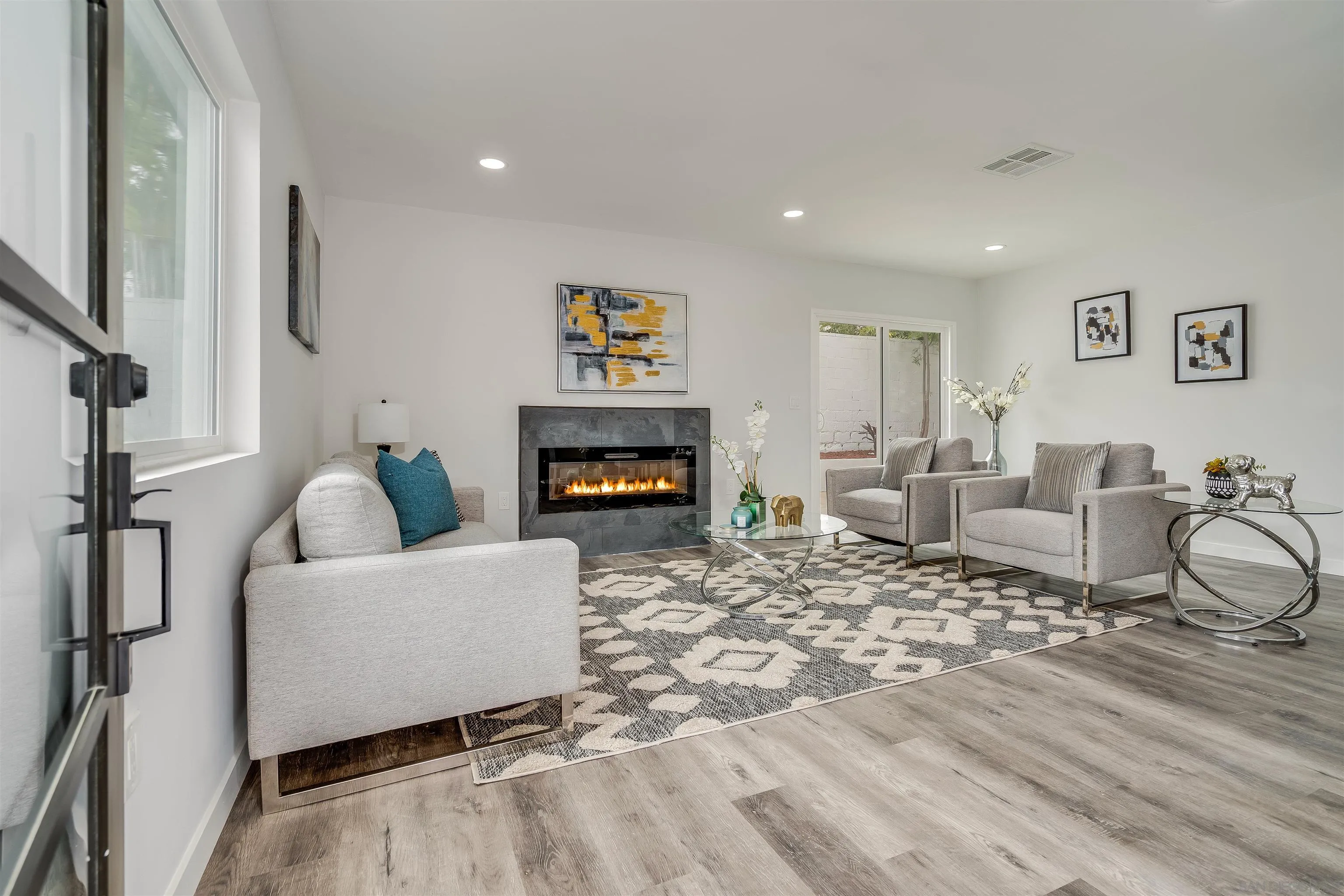 9209 Jamacha Boulevard Spring Valley, CA 91977 - Photo 3 of 22 a living room with furniture and a fireplace