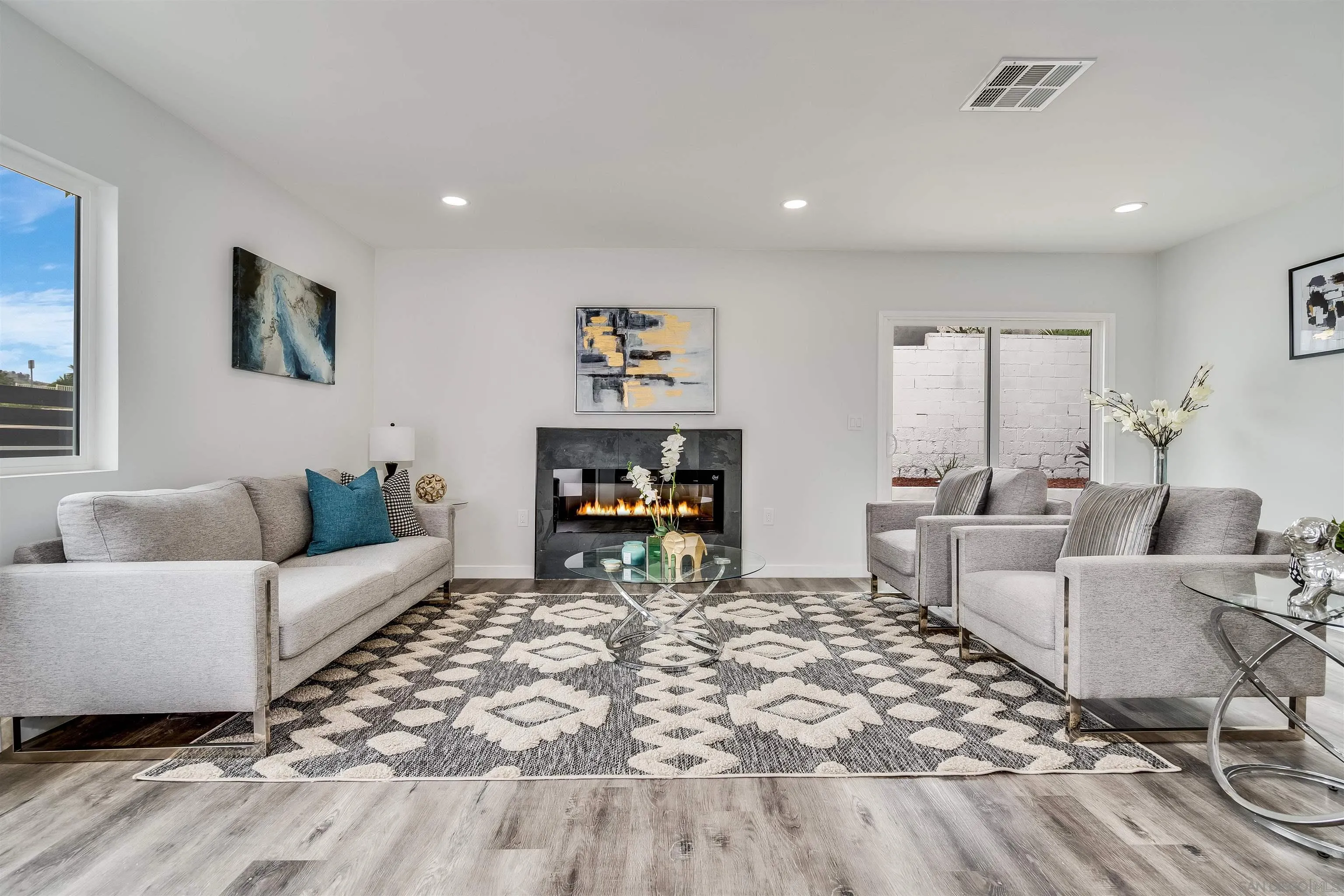 9209 Jamacha Boulevard Spring Valley, CA 91977 - Photo 4 of 22 a living room with furniture and a wooden floor