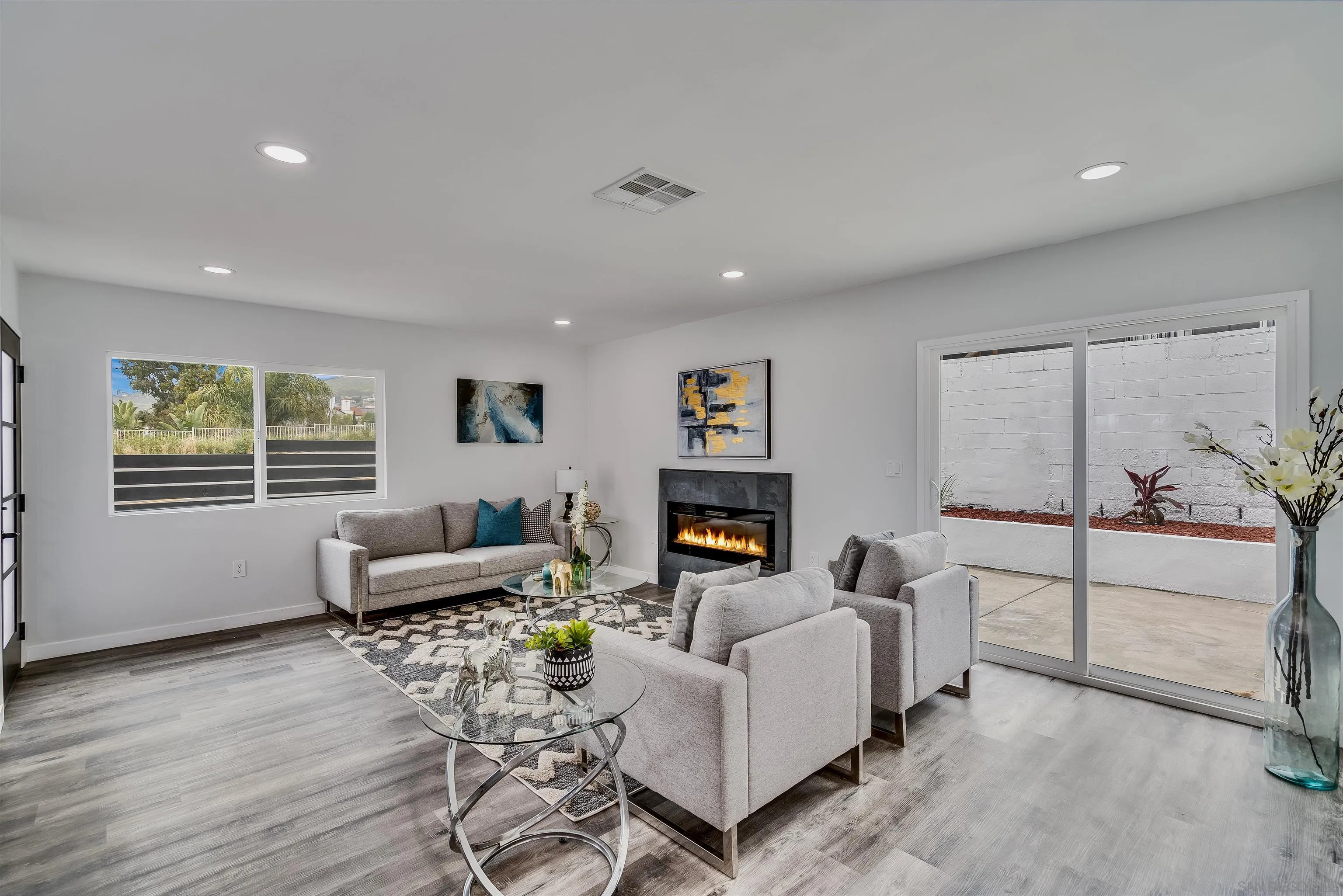 9209 Jamacha Boulevard Spring Valley, CA 91977 - Photo 5 of 22 a living room with furniture and a wooden floor