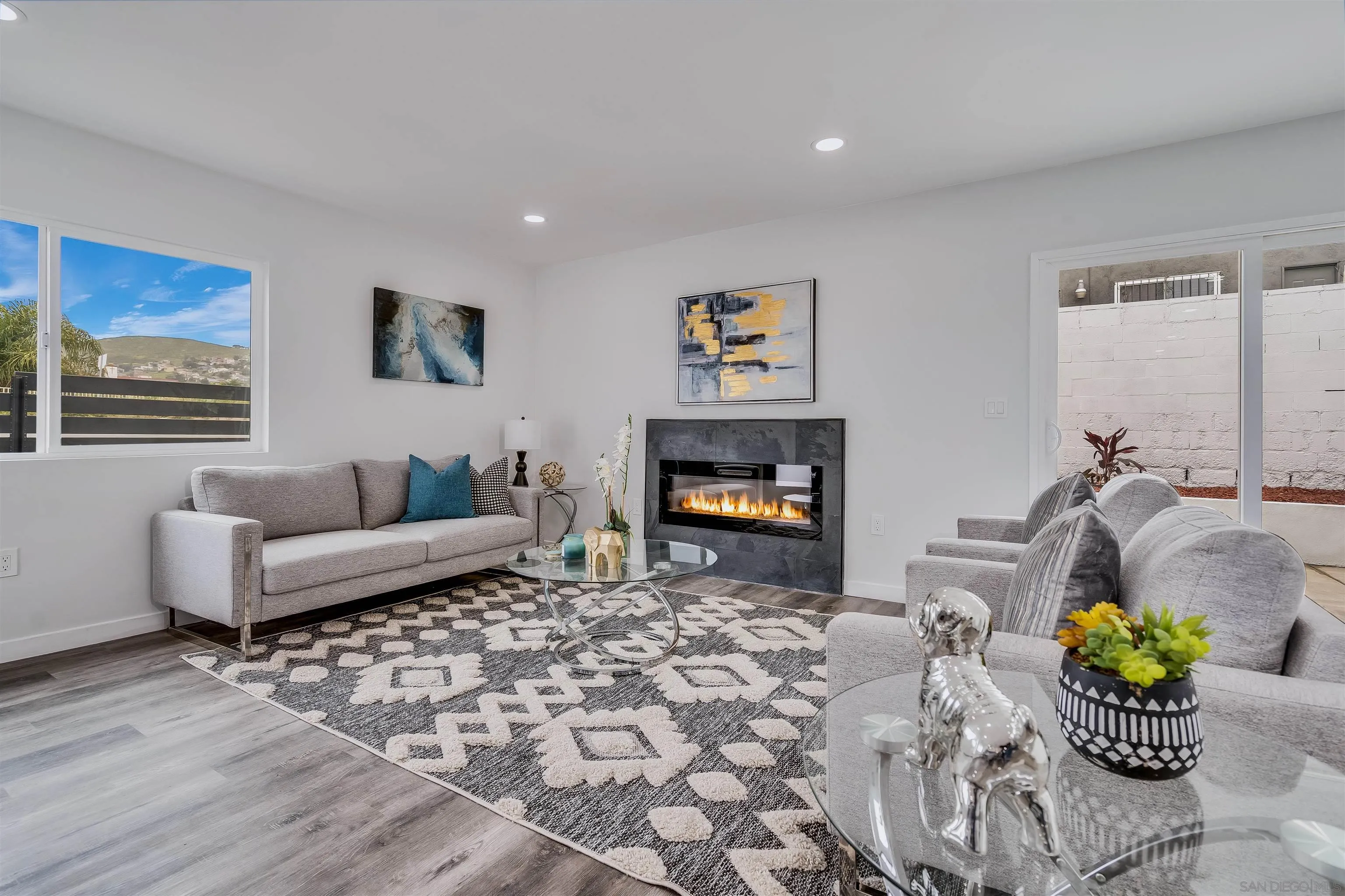 9209 Jamacha Boulevard Spring Valley, CA 91977 - Photo 6 of 22 a living room with furniture and a fireplace