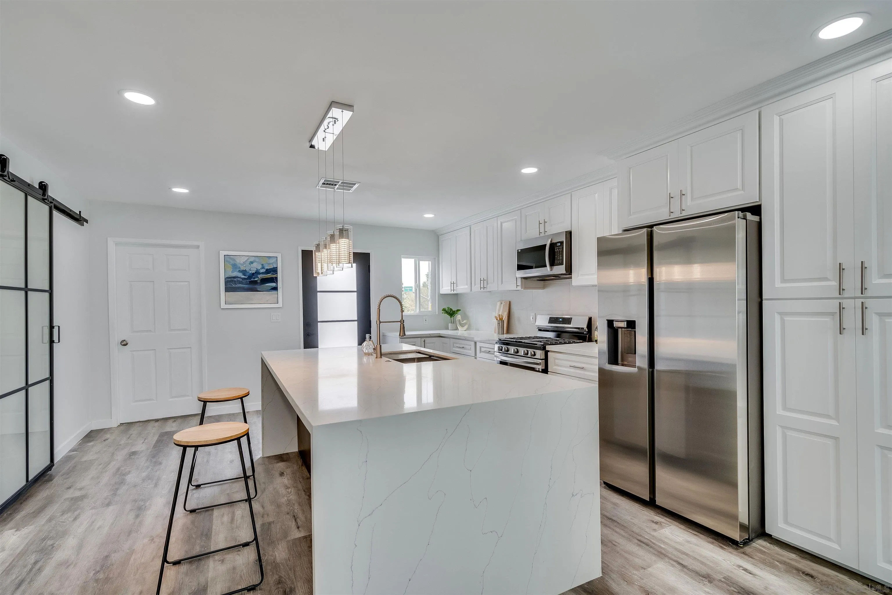9209 Jamacha Boulevard Spring Valley, CA 91977 - Photo 10 of 22 a kitchen with refrigerator and chairs