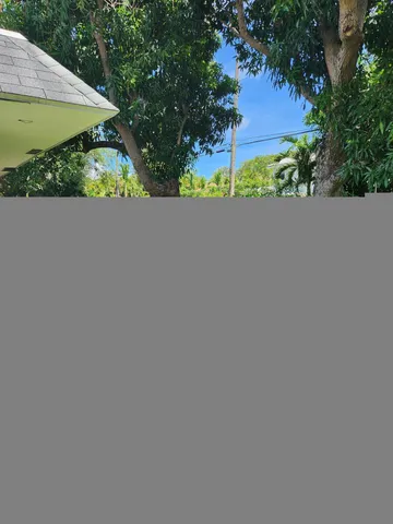 a view of a backyard with pathway