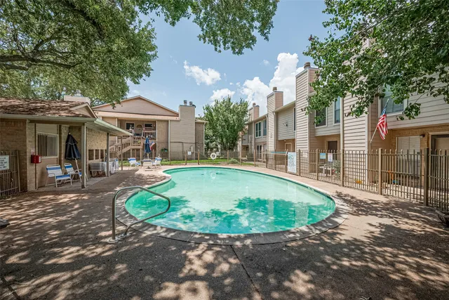 a view of a house with backyard porch and sitting area