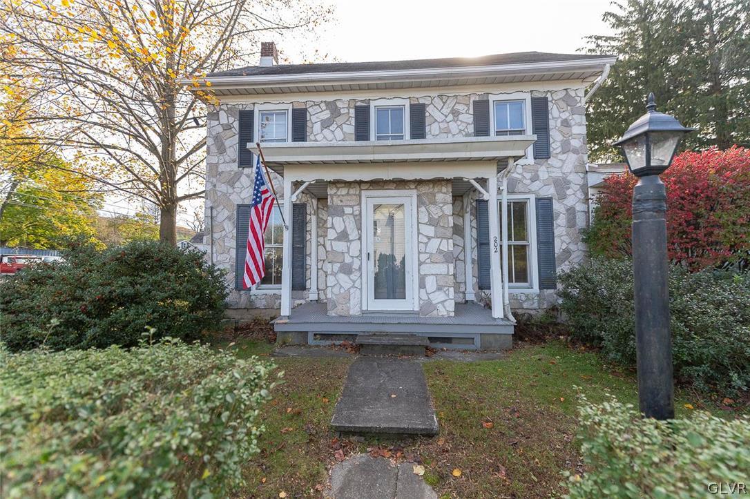 202 Fern Road Riegelsville, PA 18077 - Photo 1 of 18 a front view of a house with garden