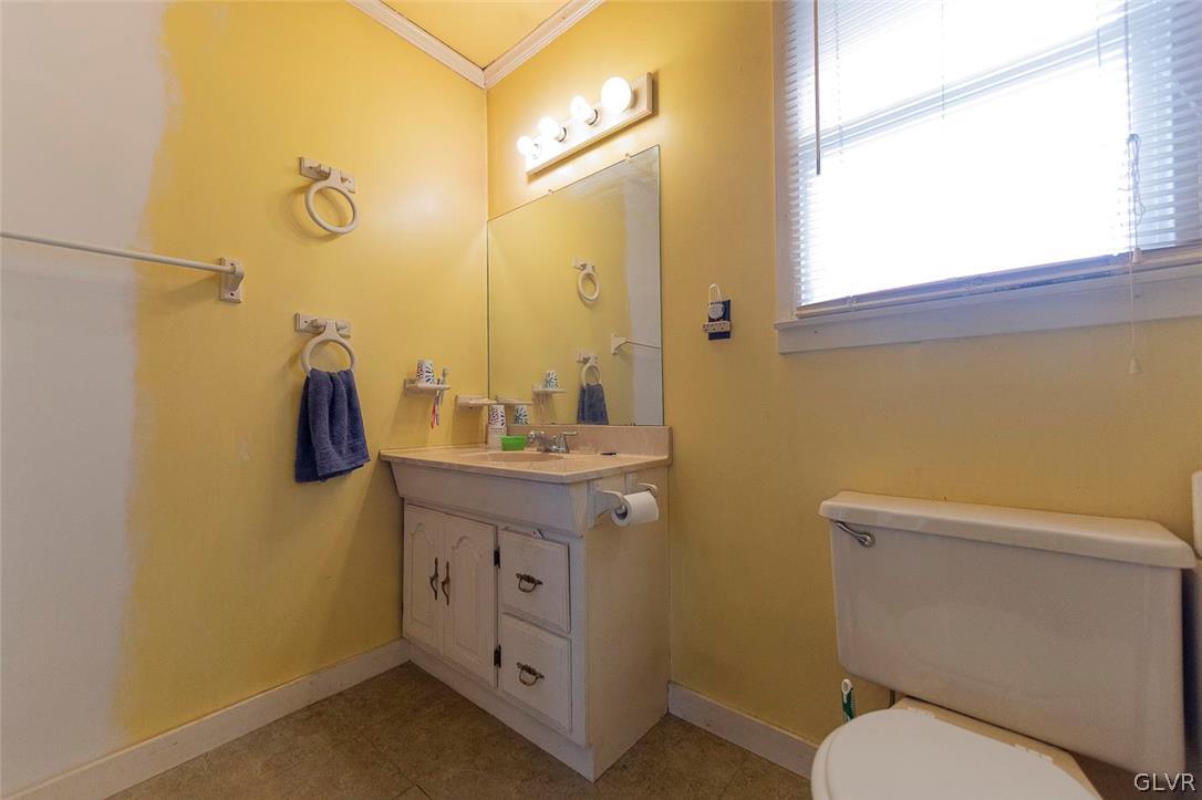 202 Fern Road Riegelsville, PA 18077 - Photo 12 of 18 a bathroom with a toilet sink and mirror