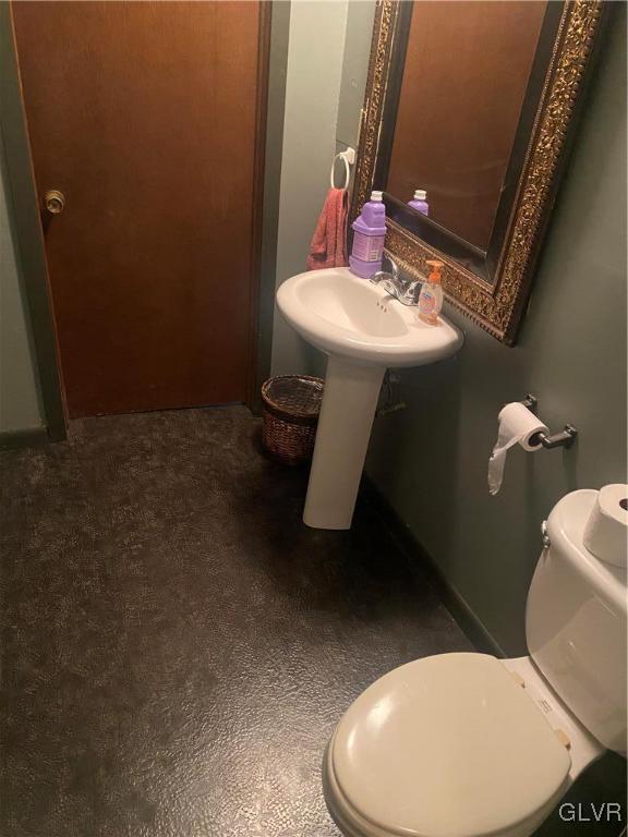 202 Fern Road Riegelsville, PA 18077 - Photo 15 of 18 a bathroom with a toilet sink and mirror