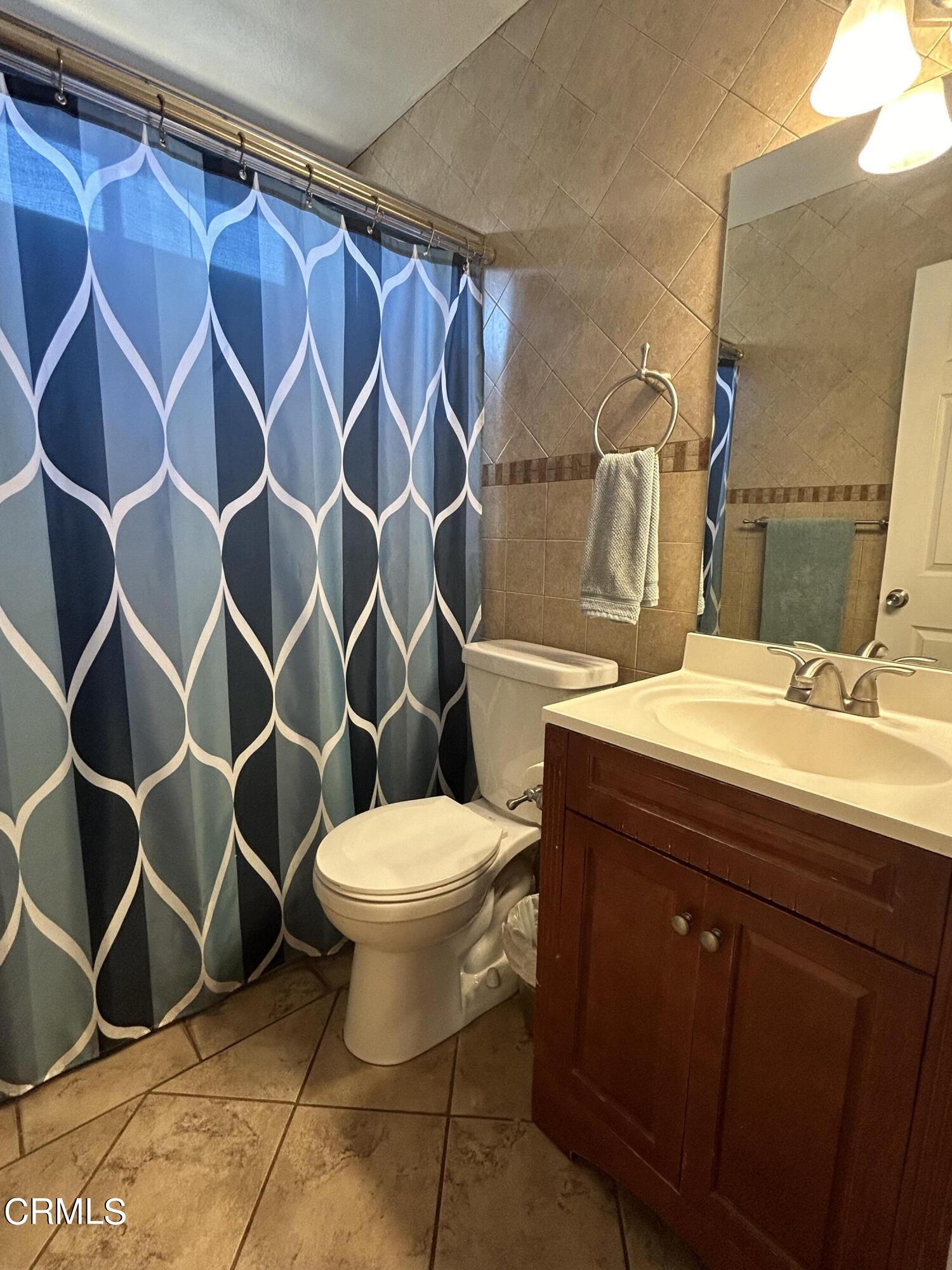 323 Sycamore Street Santa Paula, CA 93060 - Photo 13 of 20 a bathroom with a sink and a toilet