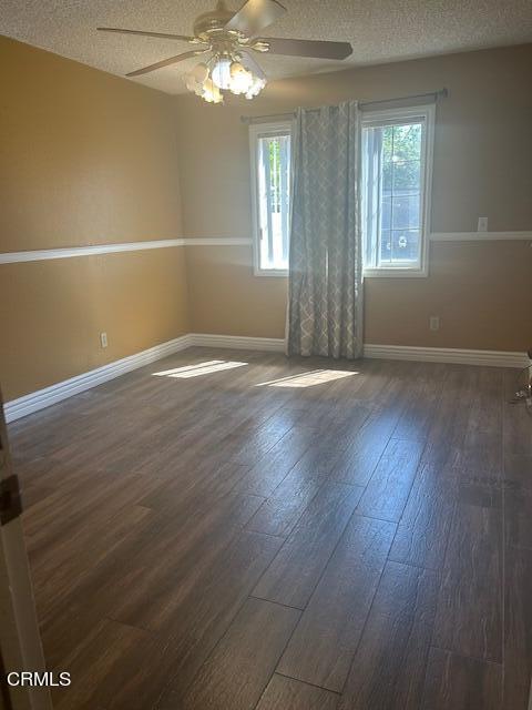 323 Sycamore Street Santa Paula, CA 93060 - Photo 14 of 20 an empty room with wooden floor and windows