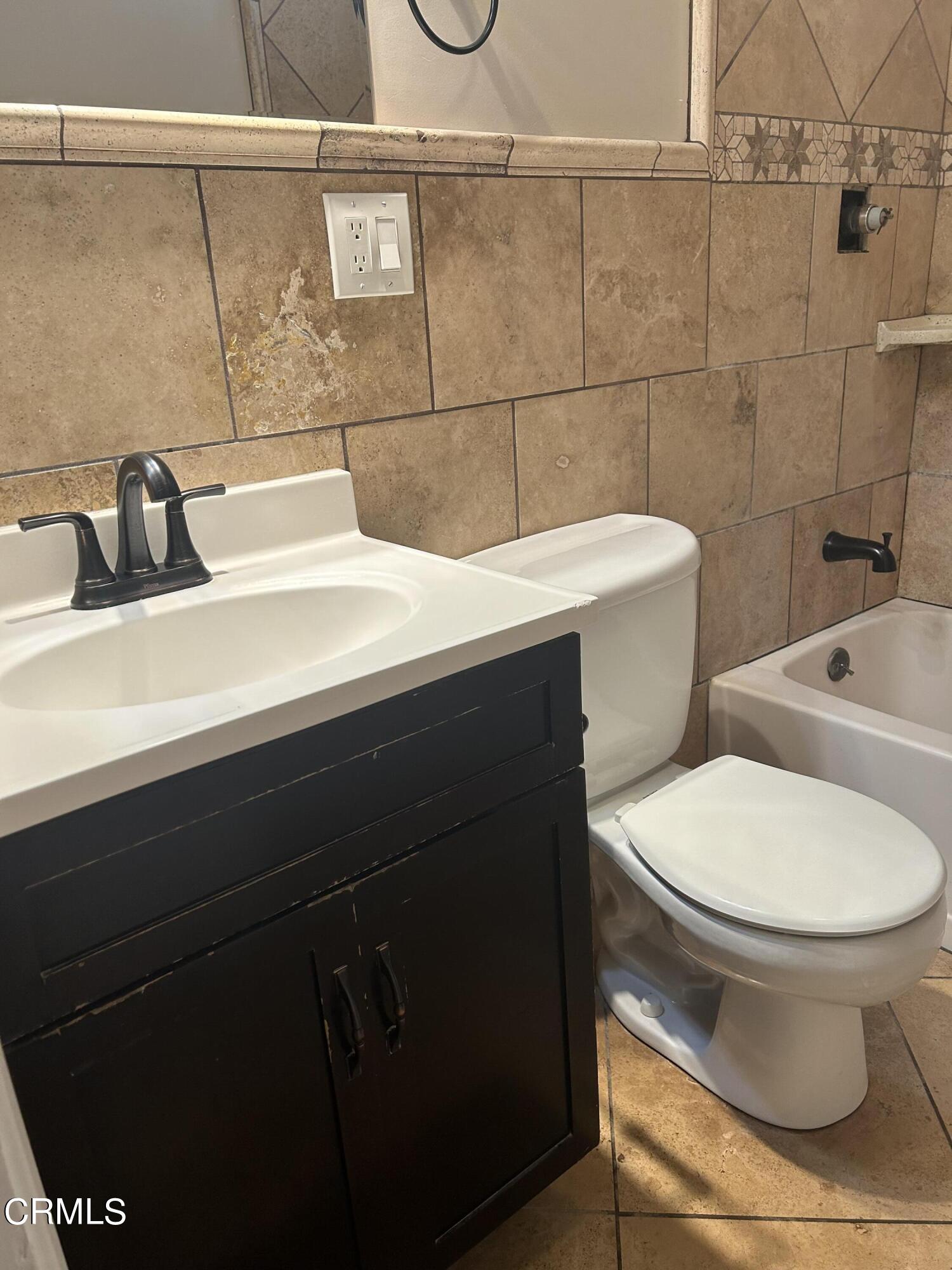 323 Sycamore Street Santa Paula, CA 93060 - Photo 17 of 20 a bathroom with a sink and a toilet