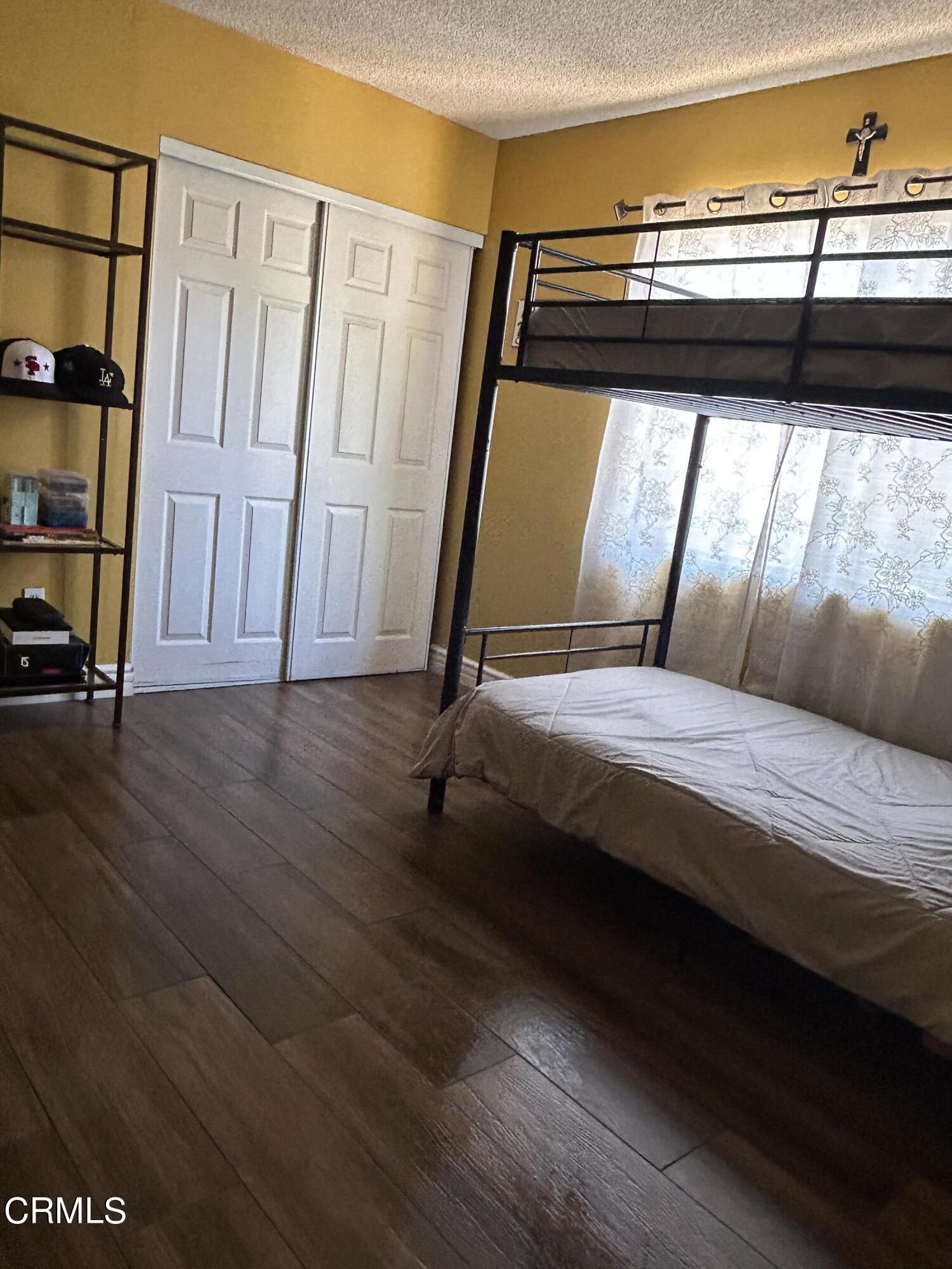 323 Sycamore Street Santa Paula, CA 93060 - Photo 18 of 20 a bedroom with a bed and a window