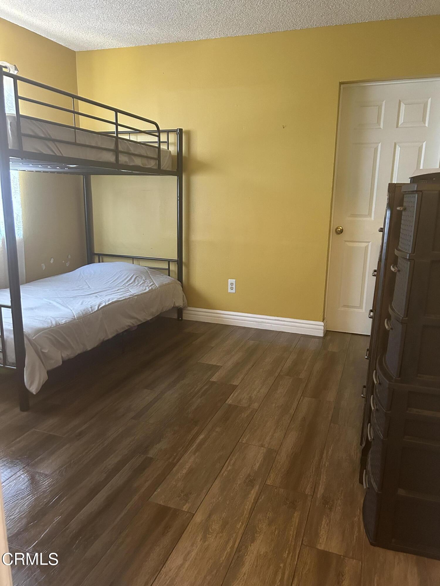 323 Sycamore Street Santa Paula, CA 93060 - Photo 20 of 20 a view of empty room with wooden floor