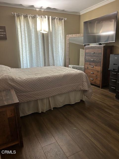 323 Sycamore Street Santa Paula, CA 93060 - Photo 9 of 20 a bedroom with a bed and chair
