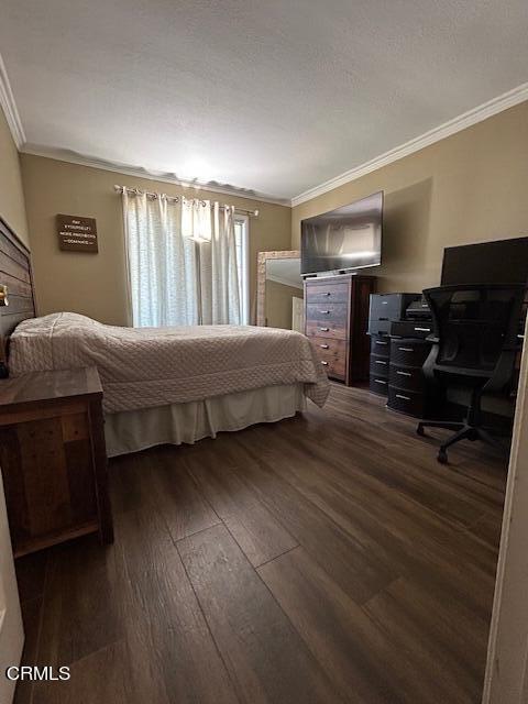 323 Sycamore Street Santa Paula, CA 93060 - Photo 10 of 20 a bedroom with a bed and wooden floor