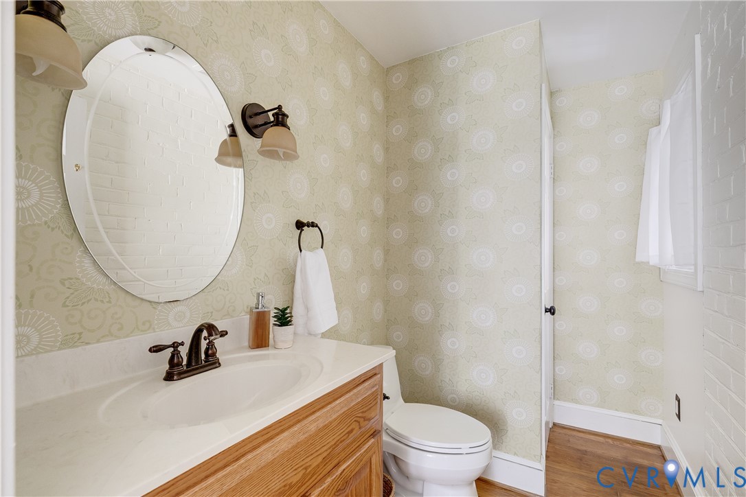 509 Wadeward Road Henrico, VA 23229 - Photo 25 of 59 a bathroom with a sink a toilet and a mirror