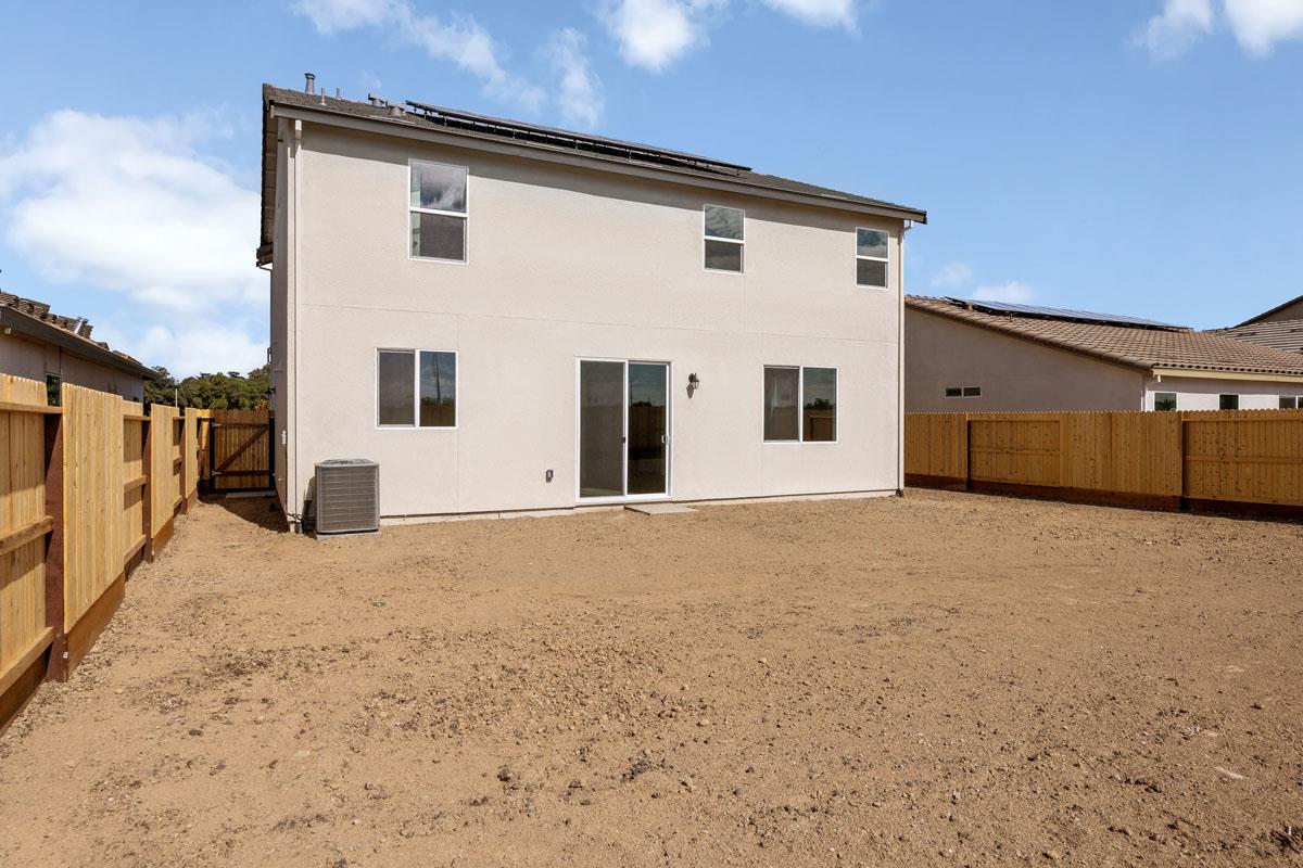 2318 East Loomis Road Stockton, CA 95205 - Photo 20 of 20 a view of a house with a backyard