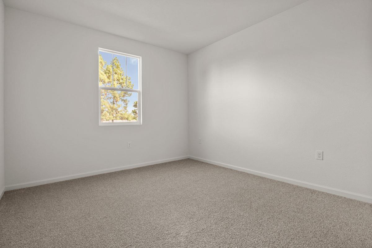 2318 East Loomis Road Stockton, CA 95205 - Photo 2 of 20 an empty room with a window