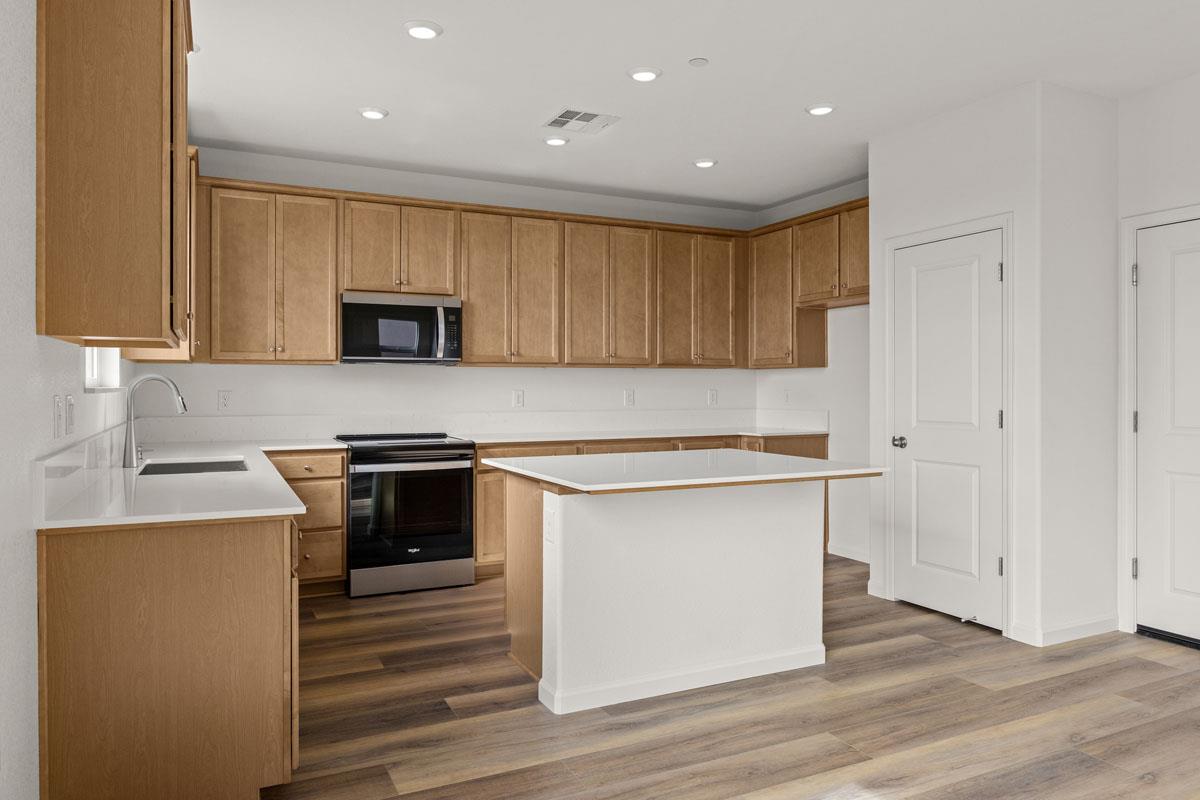 2318 East Loomis Road Stockton, CA 95205 - Photo 7 of 20 a kitchen with a sink cabinets and stainless steel appliances