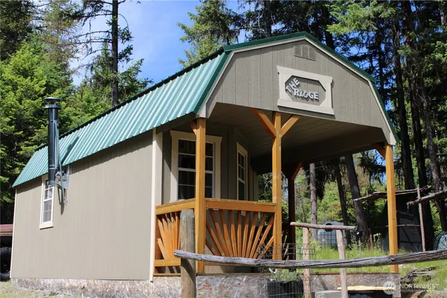 a view of small house with front door
