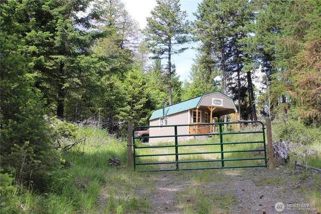 a view of swimming pool with a patio and a garden