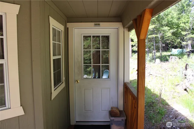 a view of a door and a window