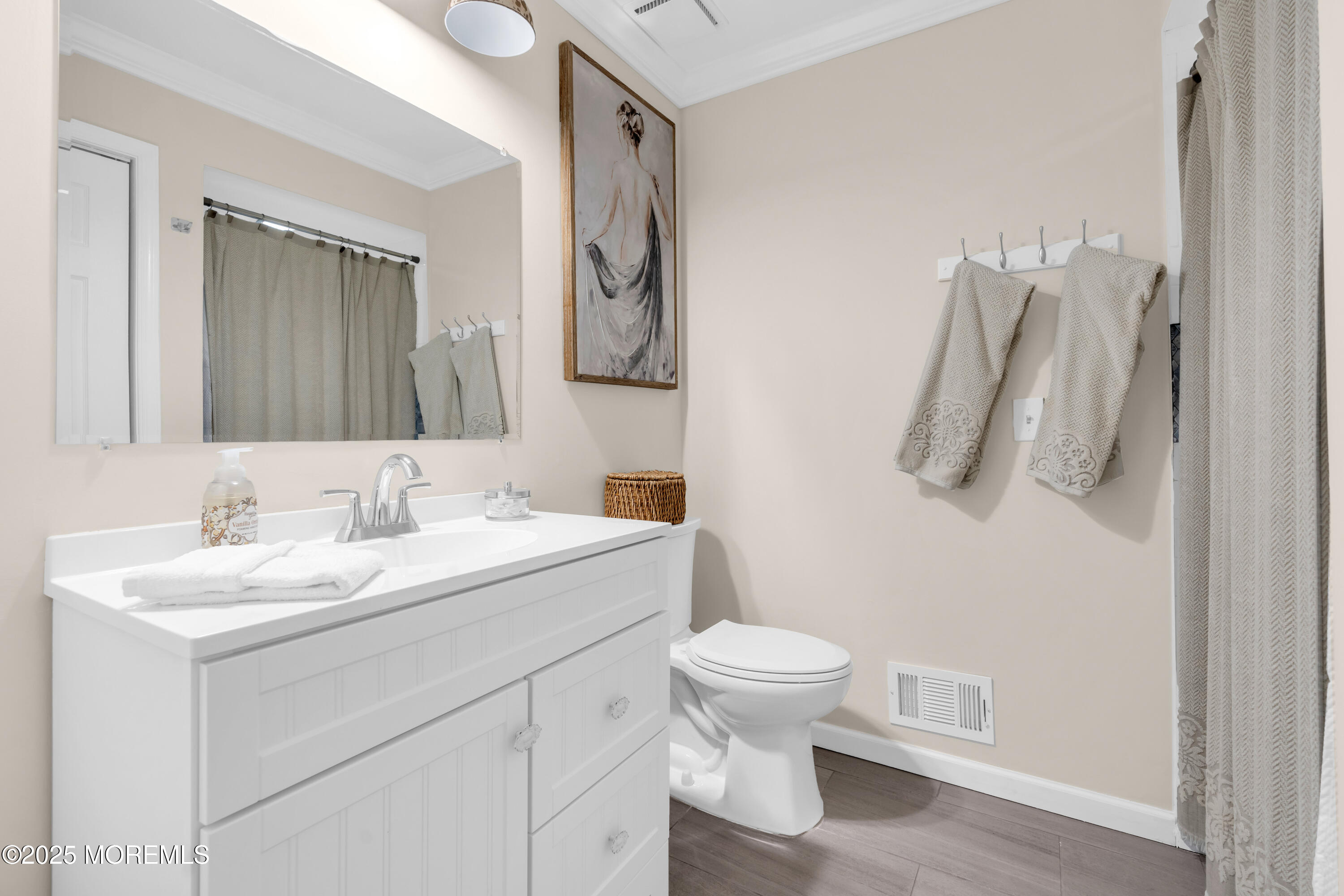 1 Portland Road, Unit 13 Highlands, NJ 07732 - Photo 25 of 40 a bathroom with a toilet sink and mirror