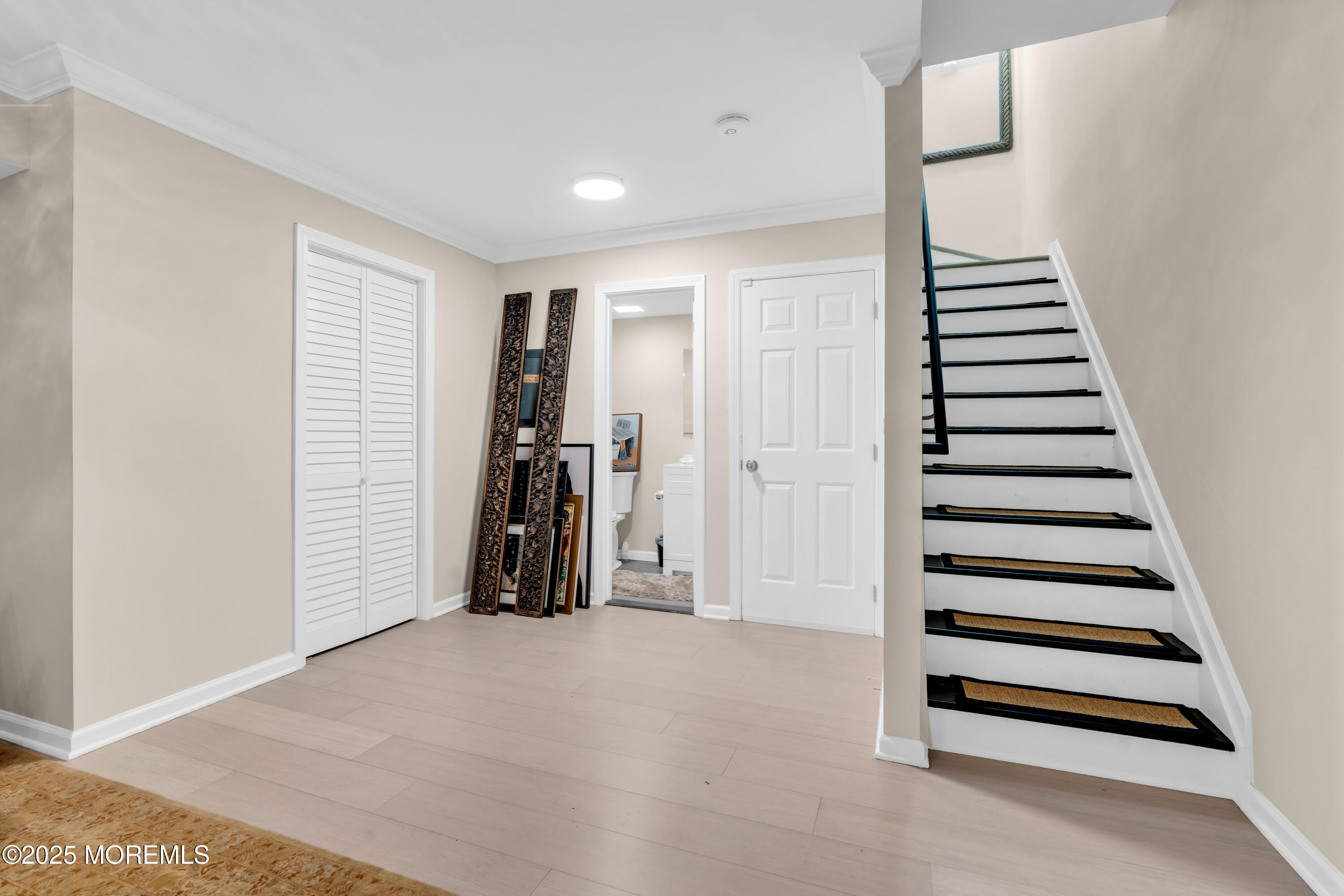 1 Portland Road, Unit 13 Highlands, NJ 07732 - Photo 27 of 40 a view of hallway with stairs and wooden floor