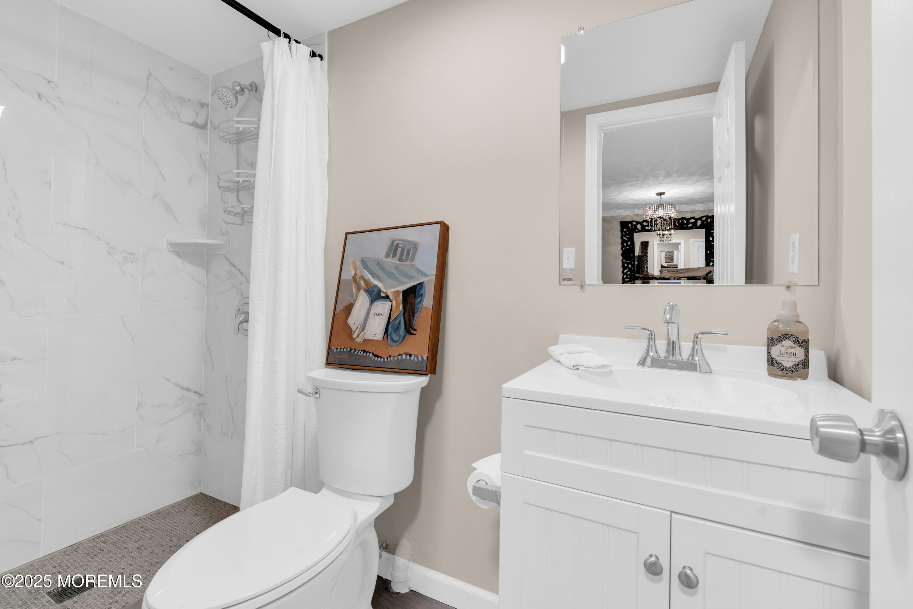 1 Portland Road, Unit 13 Highlands, NJ 07732 - Photo 29 of 40 a bathroom with a toilet a sink and a mirror