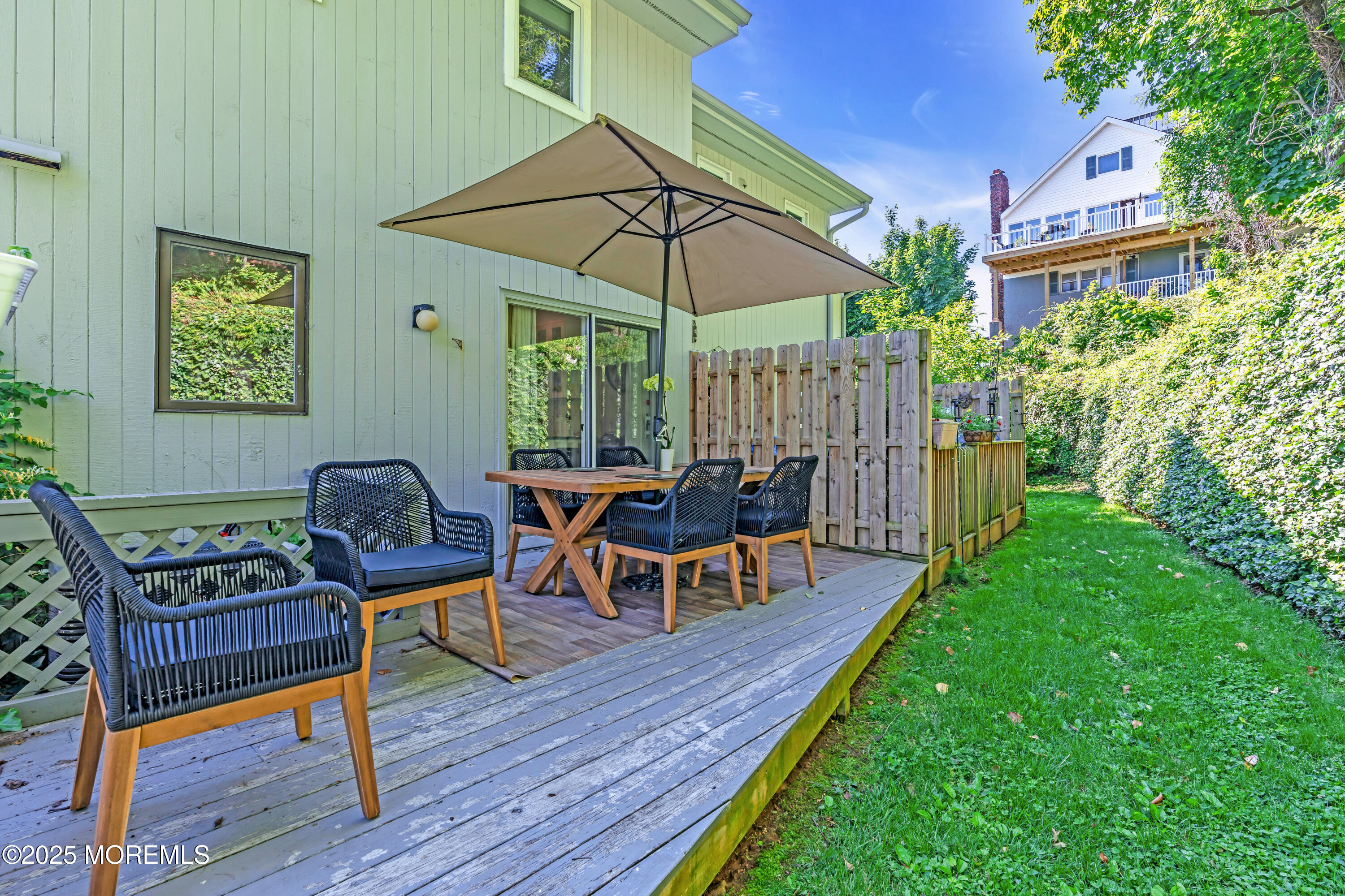1 Portland Road, Unit 13 Highlands, NJ 07732 - Photo 30 of 40 a view of a chairs and backyard with a small cabin