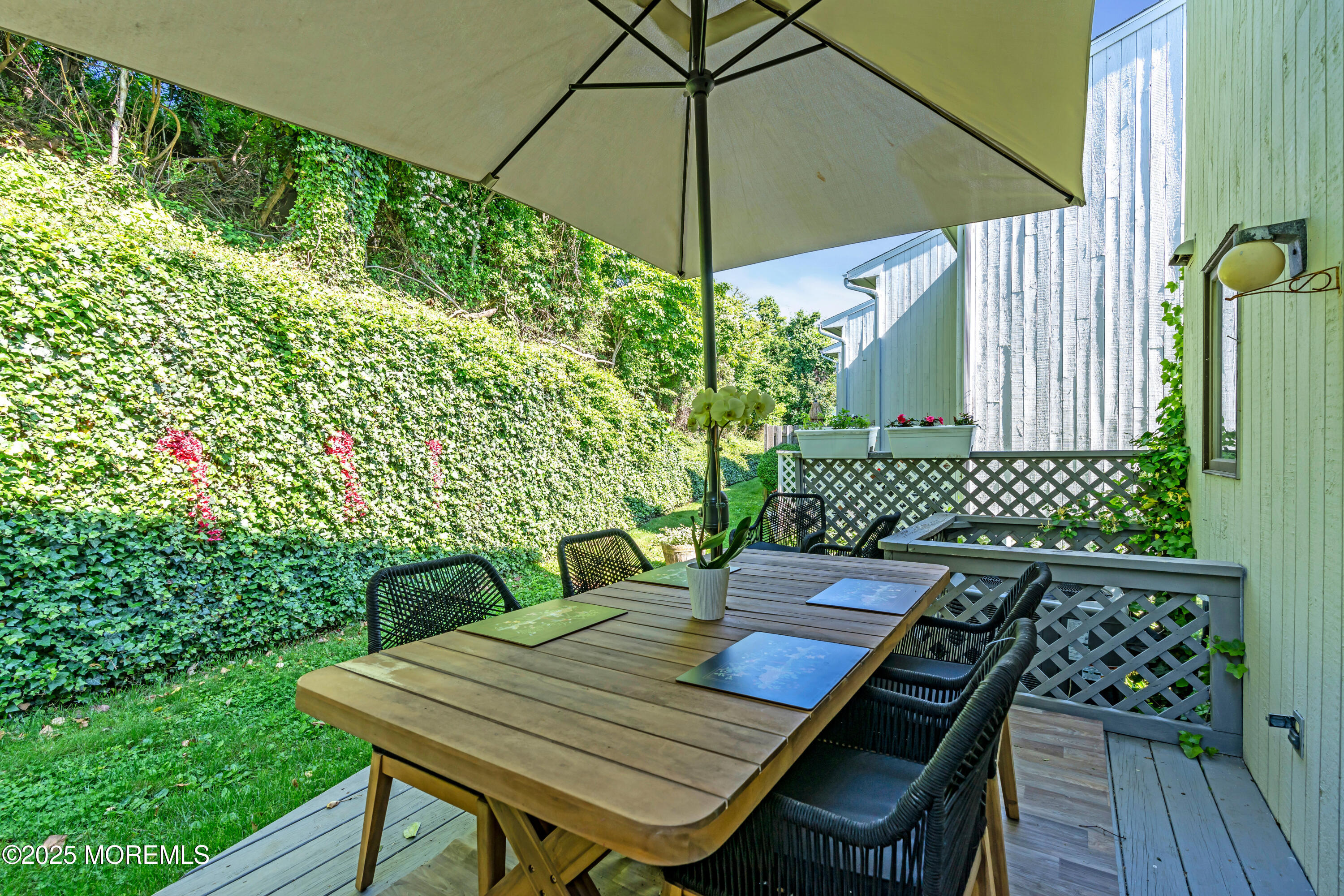 1 Portland Road, Unit 13 Highlands, NJ 07732 - Photo 31 of 40 a view of a patio with table and chairs and potted plants