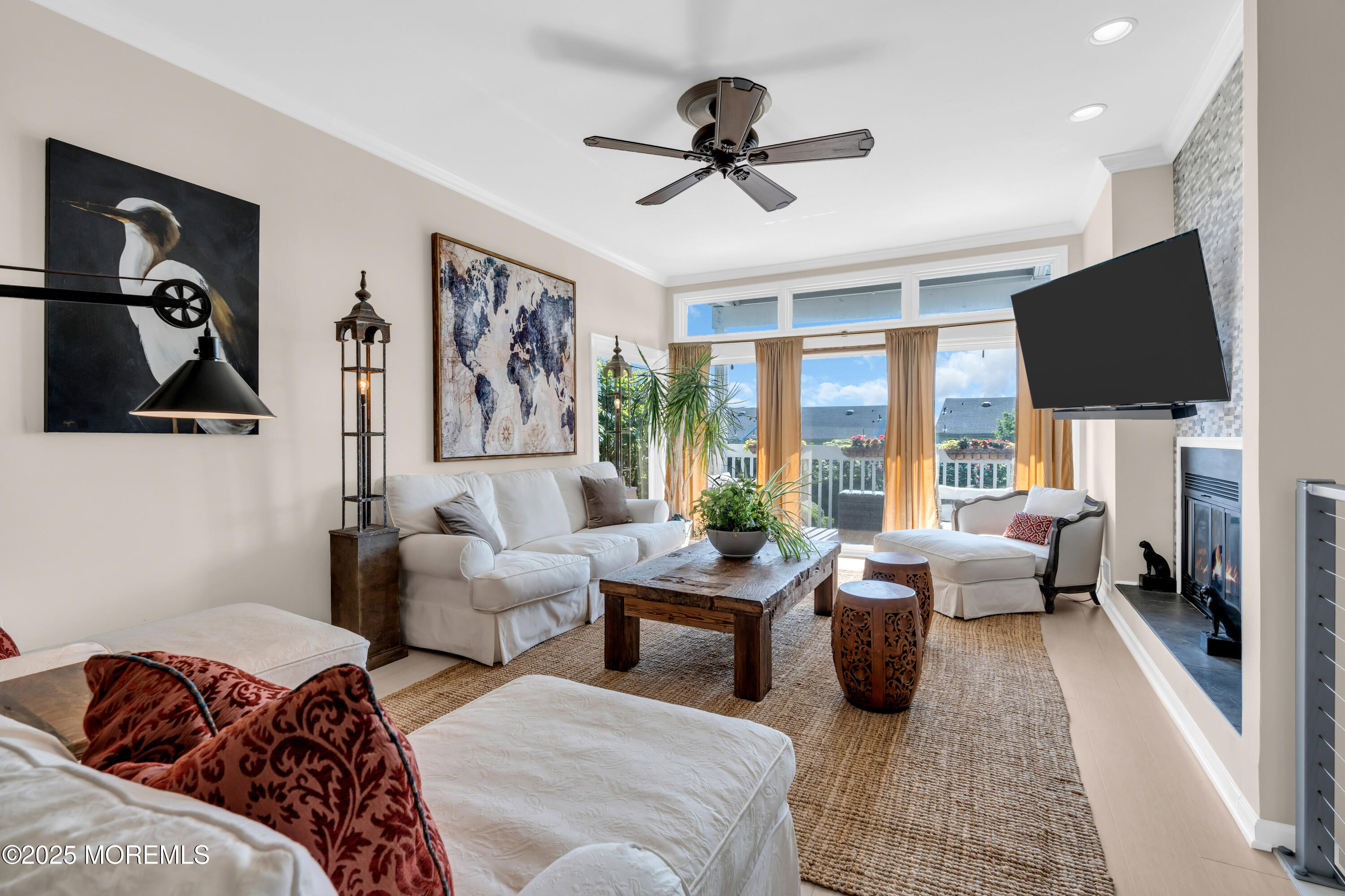 1 Portland Road, Unit 13 Highlands, NJ 07732 - Photo 4 of 40 a living room with furniture ceiling fan and a window
