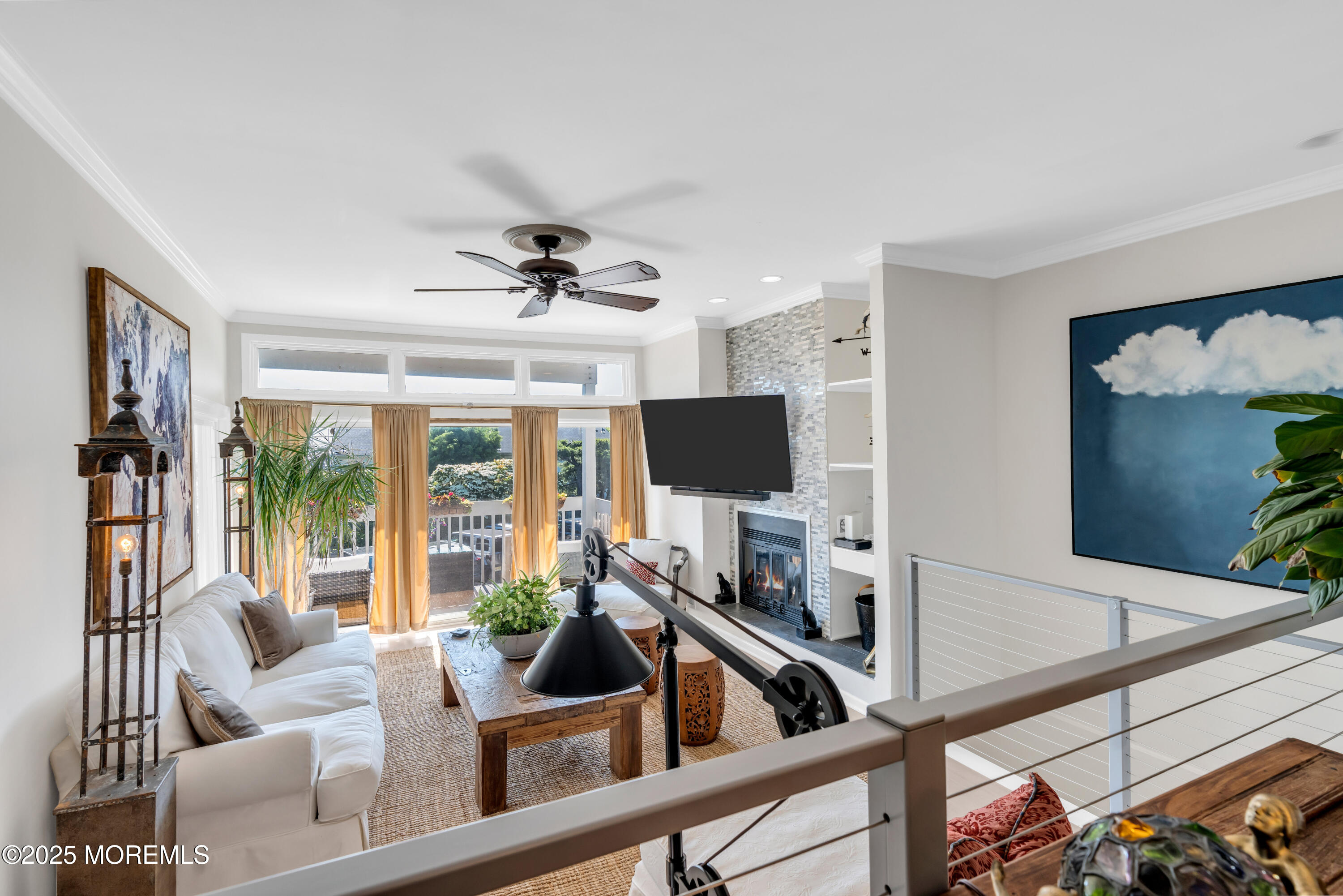 1 Portland Road, Unit 13 Highlands, NJ 07732 - Photo 8 of 40 a living room with furniture and a flat screen tv