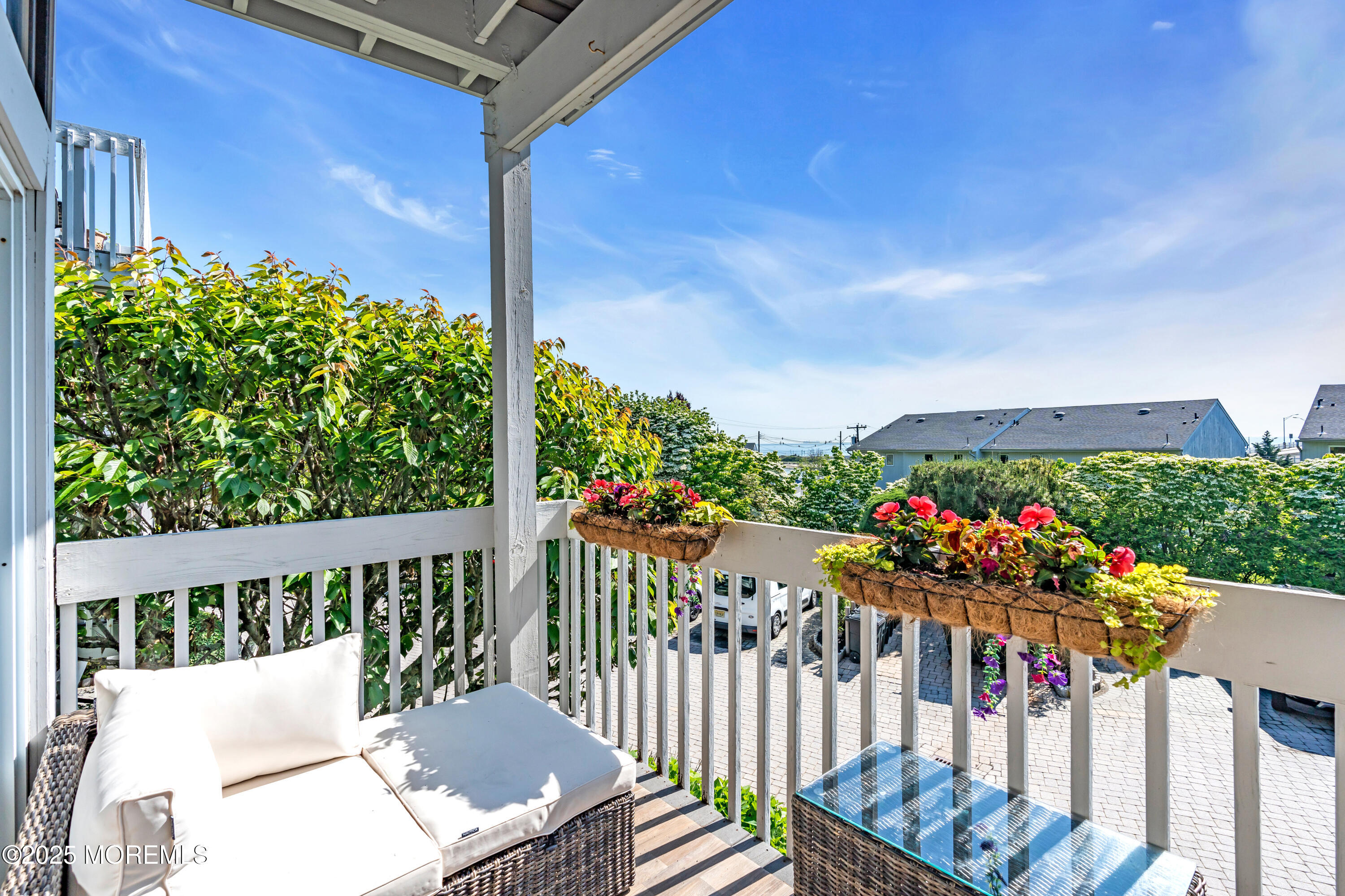 1 Portland Road, Unit 13 Highlands, NJ 07732 - Photo 9 of 40 a view of a porch with a flower garden