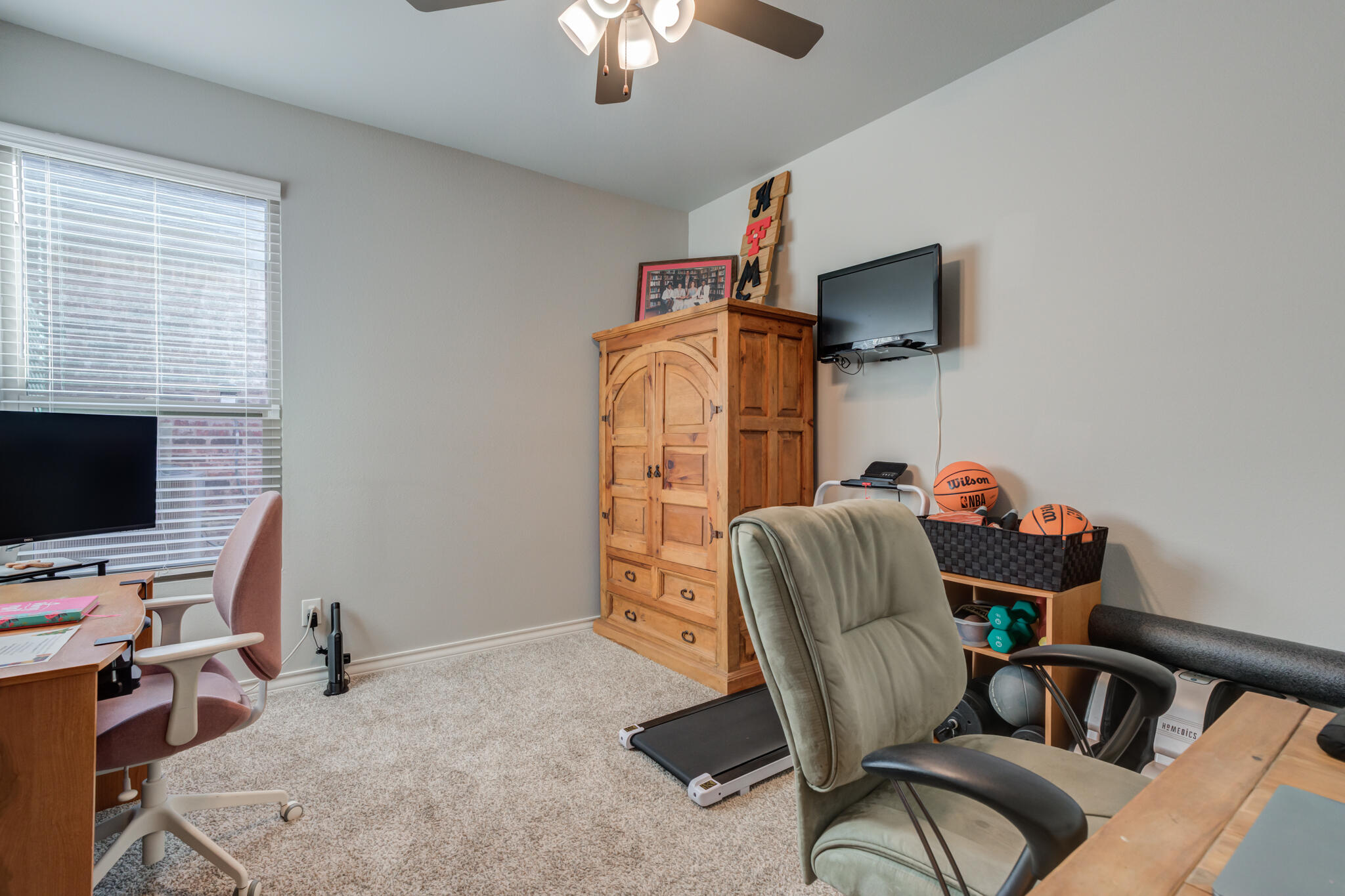 5802 Winfield Avenue Lubbock, TX 79407 - Photo 23 of 36 a view of a workspace with furniture and a window