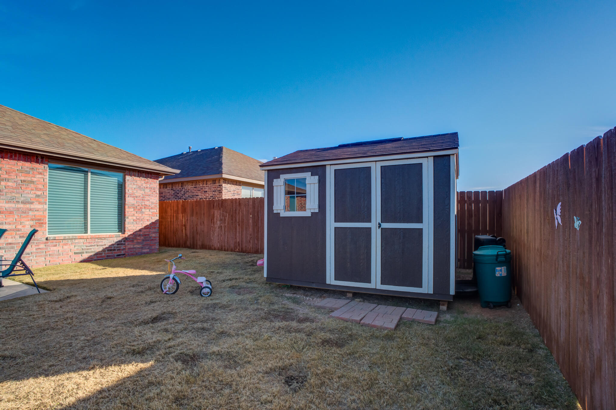 5802 Winfield Avenue Lubbock, TX 79407 - Photo 35 of 36 a view of a house with backyard and wooden fence