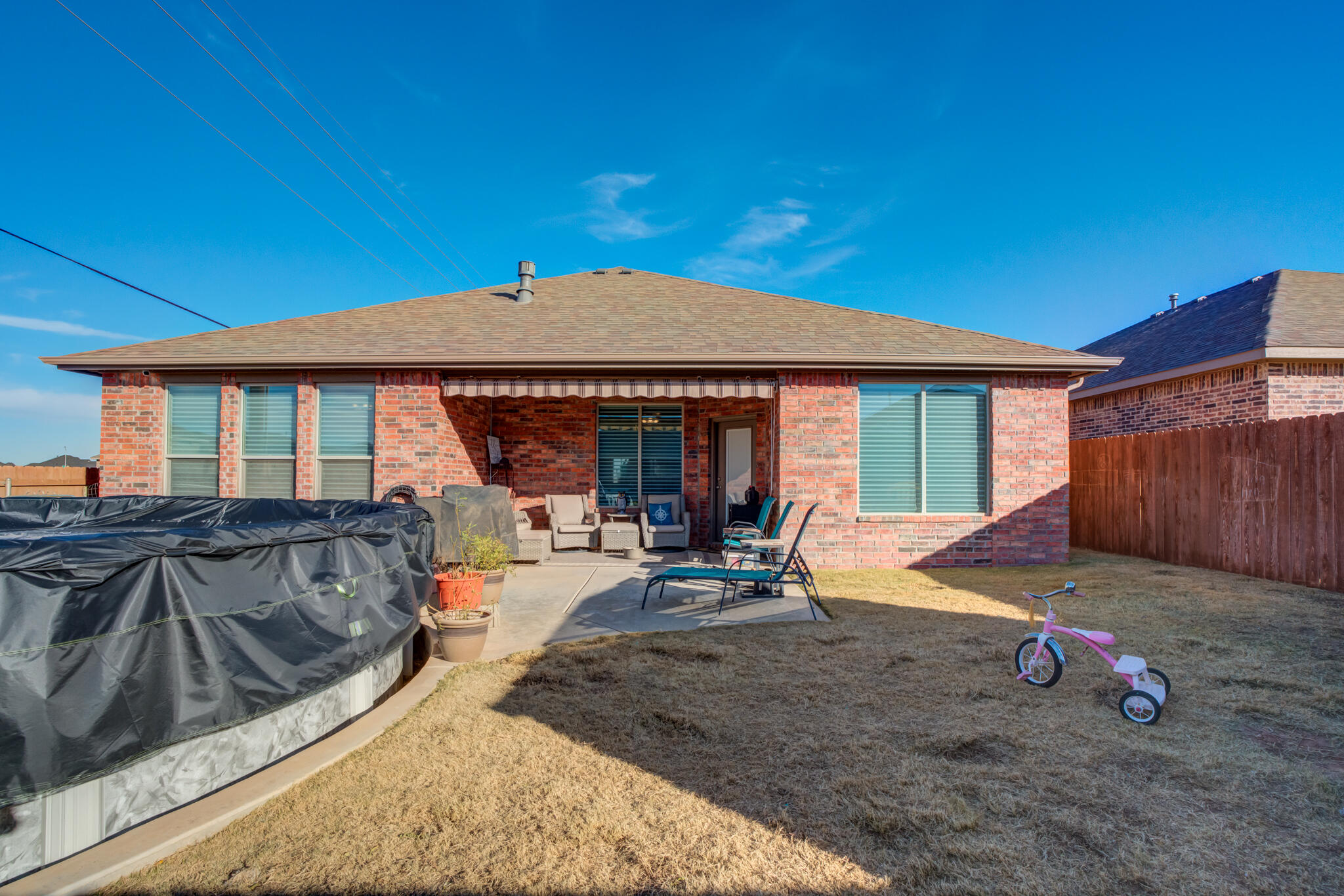 5802 Winfield Avenue Lubbock, TX 79407 - Photo 36 of 36 a view of a house with backyard and sitting area