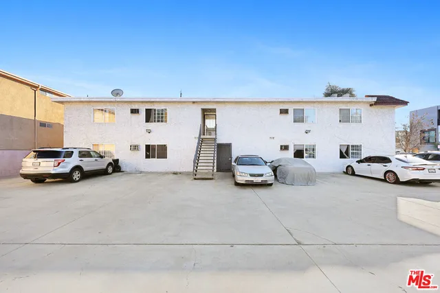 a view of yard with cars