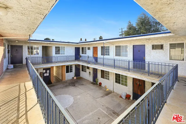 a view of a house with wooden stairs