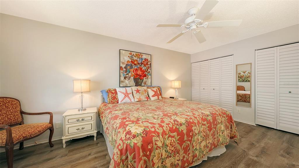 5641 Midnight Pass Road, Unit 904 Sarasota, FL 34242 - Photo 12 of 24 a bedroom with a bed and a couch