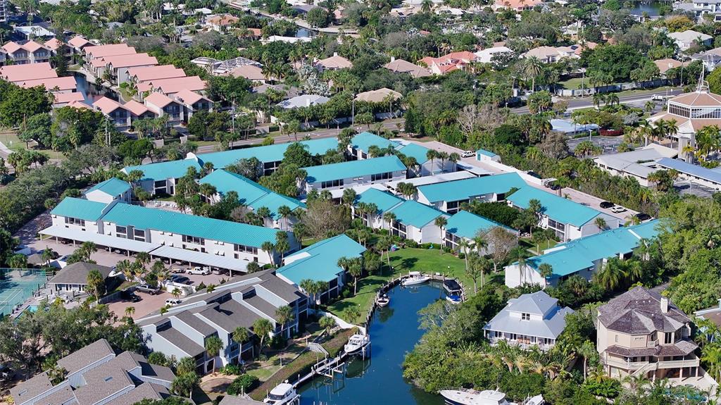 5641 Midnight Pass Road, Unit 904 Sarasota, FL 34242 - Photo 2 of 24 an aerial view of residential houses with outdoor space