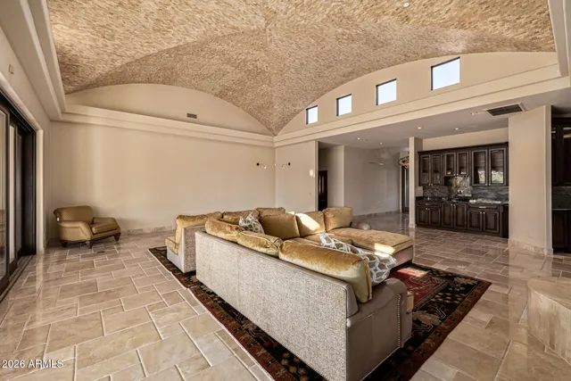 a view of a livingroom with a ceiling fan and window
