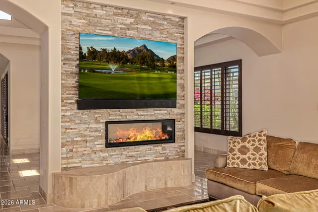 a spacious bathroom with a granite countertop sink and a mirror