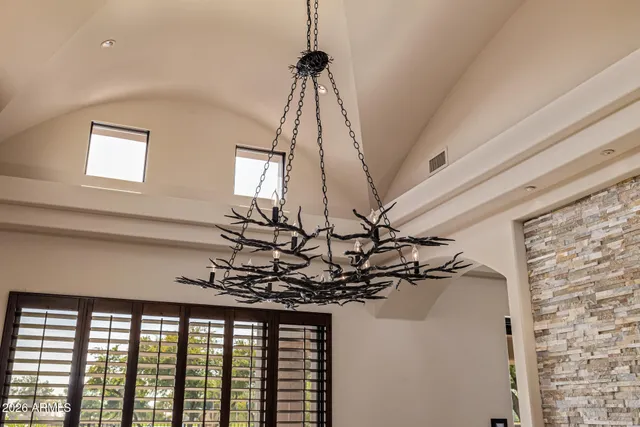 a view of an empty room with a ceiling fan