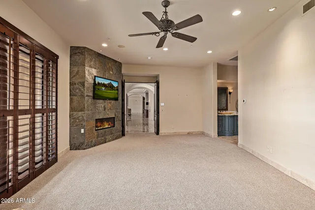 a living room with stainless steel appliances furniture and a rug