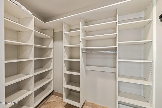 an aerial view of residential houses with outdoor space and ocean view