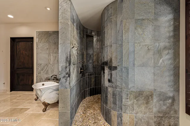 an aerial view of a houses with a swimming pool