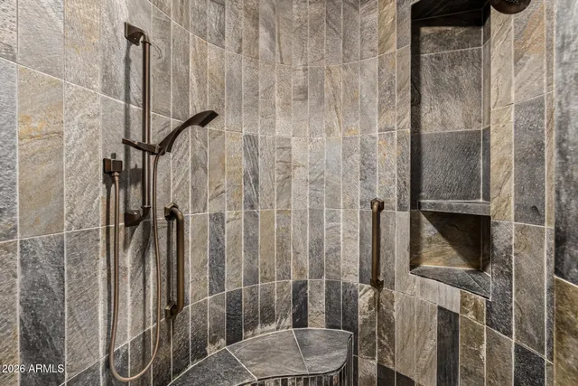 an aerial view of a house with a yard basket ball court and outdoor seating